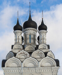 Annunciation church in Tayninskoe, Mytischi, Moscow region, Russia. Spring, cloudy sky. Traditional russian orthodox church. Domes and crosses