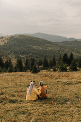 couple in love enjoying each other and walking in the mountains