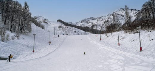 Fototapeta na wymiar Skiing and snowboarding in the mountain ski resort of Krasnaya Polyana , Russia.