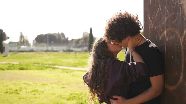 jealousy, betrayal - young man surprises his girlfriend who kisses another