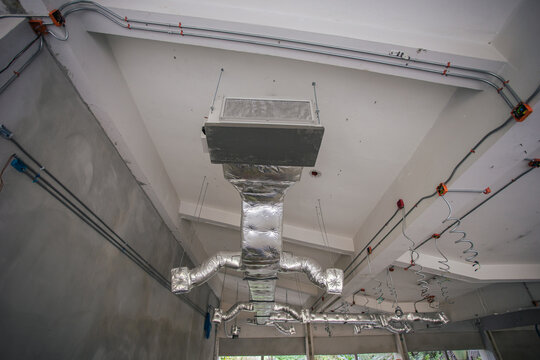 Ducting work for air conditioner ceiling type. Installation AC Ductwork in the construction site.