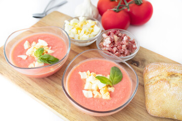 Salmorejo, cold tomato soup typical of Spanish cuisine. Tomato soup with boiled egg and Serrano ham, typical of Andalusian cuisine. Food photography
