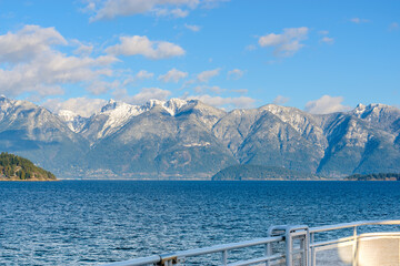 Fantastic view over ocean, snow mountain and rocks at Sechelt inlet in Vancouver, Canada.