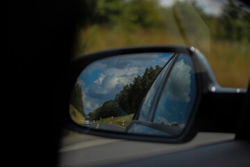driving on a road , The cloud in the mirror 