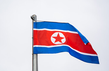 flag of north korean waving in the sky