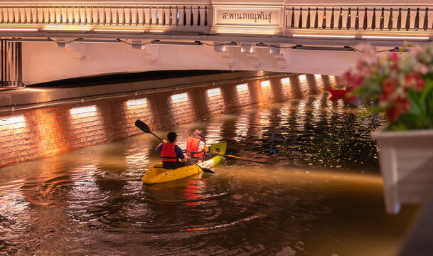 A tourist rowing a boat in Ong Ang Canal, new walking street in bangkok city.