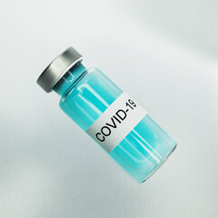 medical ampoule with blue liquid and the inscription Covid 10