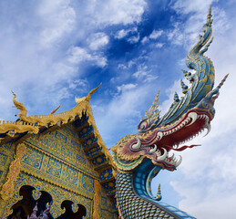 Fototapeta na wymiar Dragon guard - exterior detail of Famous Wat Rong Suea Ten, or Blue Temple in Chiangrai, Chiang Rai Province, Northern Thailand