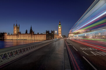 big ben at night with passing bus in blue hour