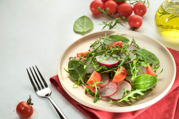 Green vegan salad from green leaves mix and vegetables