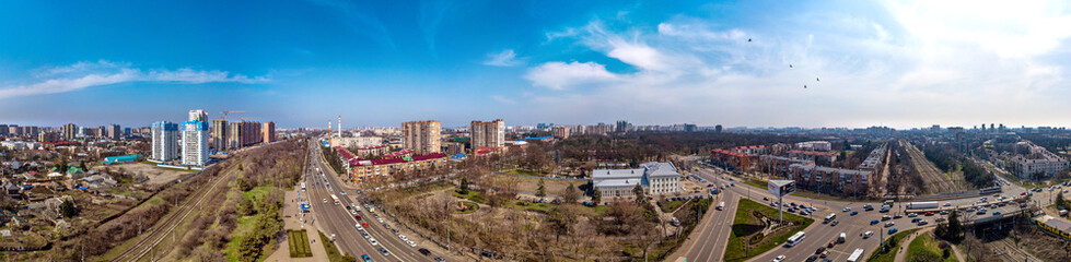 Obraz premium urban aerial landscape on a sunny day - industrial area with a park and old abandoned factories on the northern outskirts of Krasnodar city and near the railway and highway