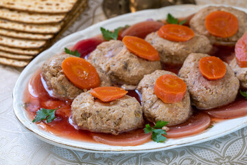 Gefilte fish. Fish cakes on a platter, decorated with beets, markers and parsley.