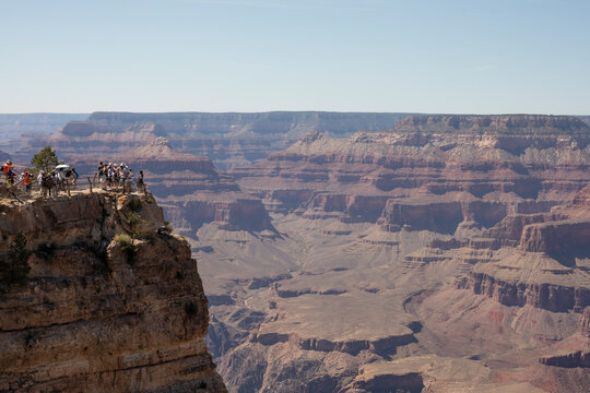 Panorama photo of the Grand Canyon in Arizona with tourists