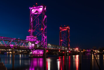 Obraz premium Colorful bridge illuminated at sunset and blue hour