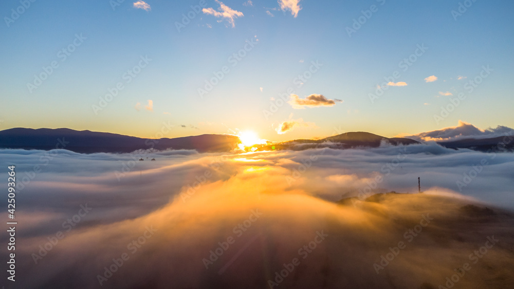 Wall mural sunrise over the hills