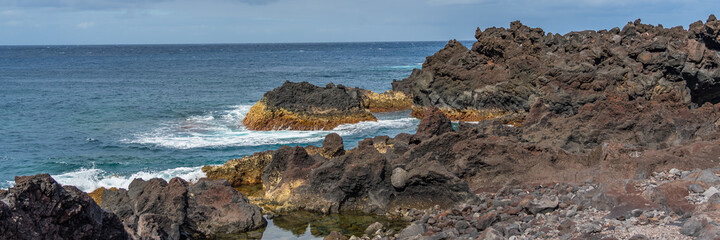 Natural volcanic rocks near Ponta da Ferraria, Sao Miguel island, Azores
