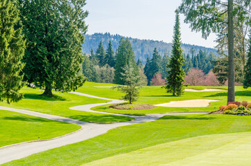 Golf course with gorgeous green and sand bunker.