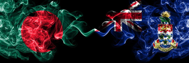 Bangladesh, Bangladeshi vs British, Britain, Cayman Islands smoky mystic flags placed side by side. Thick colored silky abstract smokes flags.