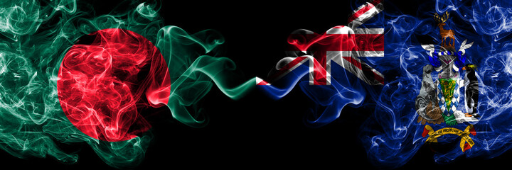 Bangladesh, Bangladeshi vs British, Britain, South Georgia and the South Sandwich Islands smoky mystic flags placed side by side. Thick colored silky abstract smokes flags.