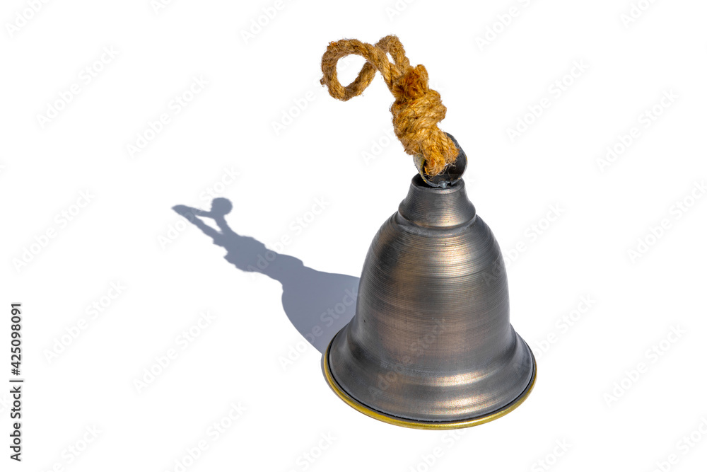 Wall mural old vintage brass metal bell isolated on a white background.