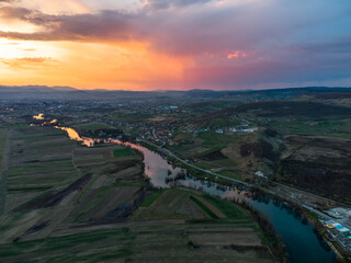 sunset over the river and city