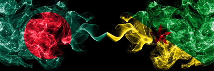 Bangladesh, Bangladeshi vs France, French Guiana smoky mystic flags placed side by side. Thick colored silky abstract smokes flags.