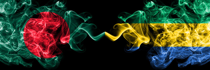 Bangladesh, Bangladeshi vs Gabon, Gabonese, Gabonian smoky mystic flags placed side by side. Thick...