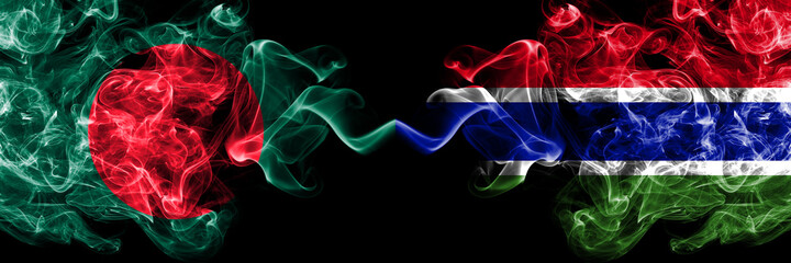 Bangladesh, Bangladeshi vs Gambia, Gambian smoky mystic flags placed side by side. Thick colored silky abstract smokes flags.