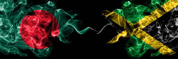 Bangladesh, Bangladeshi vs Jamaica, Jamaican smoky mystic flags placed side by side. Thick colored silky abstract smokes flags.