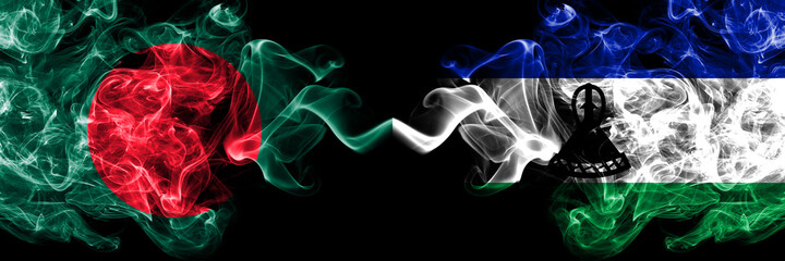 Bangladesh, Bangladeshi vs Lesotho smoky mystic flags placed side by side. Thick colored silky abstract smokes flags.