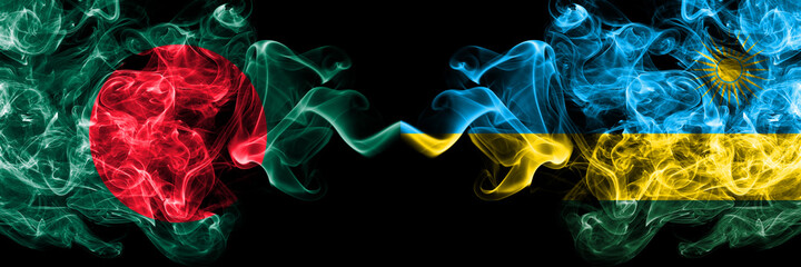Bangladesh, Bangladeshi vs Rwanda smoky mystic flags placed side by side. Thick colored silky abstract smokes flags.