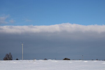 cloud scenery with a lamp post in the foreground