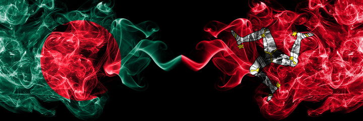 Obraz premium Bangladesh, Bangladeshi vs United Kingdom, Great Britain, British, Isle of Mann smoky mystic flags placed side by side. Thick colored silky abstract smokes flags.
