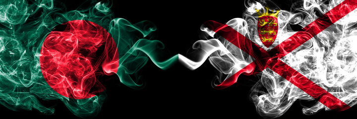 Bangladesh, Bangladeshi vs United Kingdom, Great Britain, British, Jersey smoky mystic flags placed side by side. Thick colored silky abstract smokes flags.