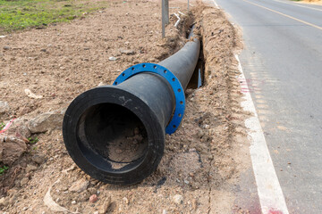 Construction site with new Water Pipes in the ground. sewer pipes to repair or restore in street...