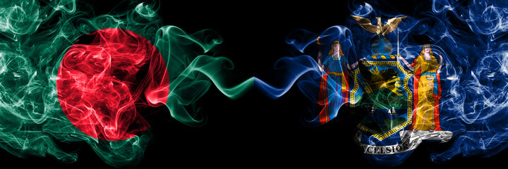 Obraz premium Bangladesh, Bangladeshi vs United States of America, America, US, USA, American, New York smoky mystic flags placed side by side. Thick colored silky abstract smokes flags.