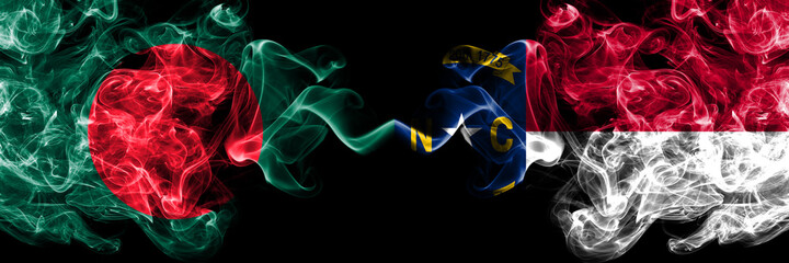 Bangladesh, Bangladeshi vs United States of America, America, US, USA, American, North Carolina smoky mystic flags placed side by side. Thick colored silky abstract smokes flags.