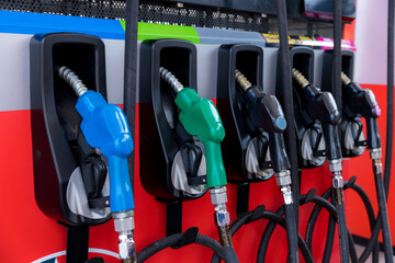 Fuel Pump, Gas Station, Gasoline. Colorful Petrol pump filling nozzles isolated on white background...