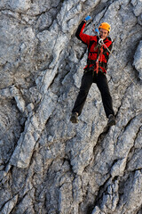 Climbing alpinist on Koenigsjodler route, Austria
