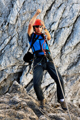 Alpinist climbing on Koenigsjodler Ridge, Austrian Alps, Europe