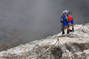 Climbing alpinist on Koenigsjodler route, Austria