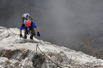 Alpinist climbing on Koenigsjodler Ridge, Austrian Alps, Europe