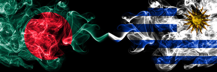Bangladesh, Bangladeshi vs Uruguay, Uruguayan smoky mystic flags placed side by side. Thick colored silky abstract smokes flags.