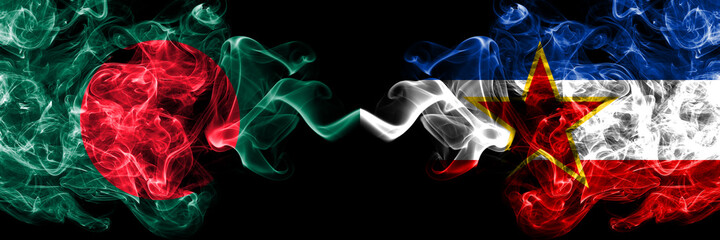 Bangladesh, Bangladeshi vs Yugoslavia, Yugoslavian smoky mystic flags placed side by side. Thick colored silky abstract smokes flags.