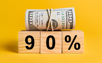 90 interest with money on a yellow background. The concept of business, finance, credit, income,...