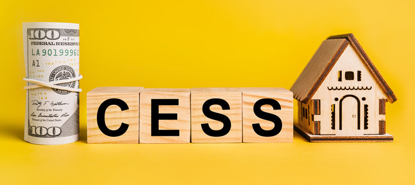 cess with house miniature model and money on a yellow background. The concept of business, finance, credit, tax , real estate, home, housing