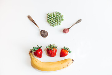 strawberry, banana, green peas on the table
