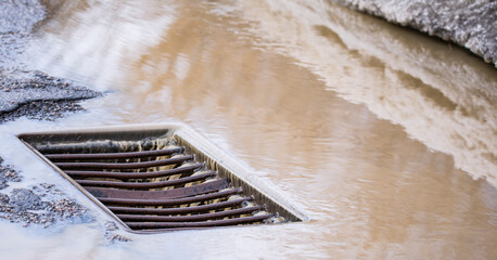 storm drain grate large on the road
