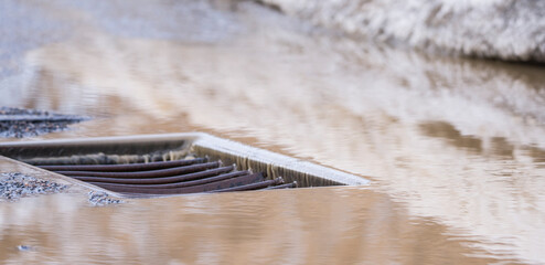 storm drain grate large on the road
