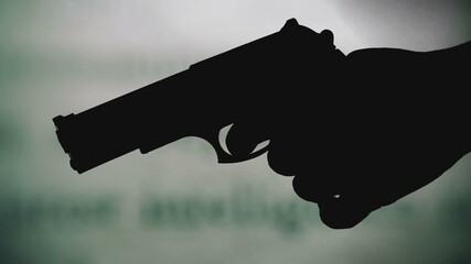 Gun silhouette against intelligence report concept